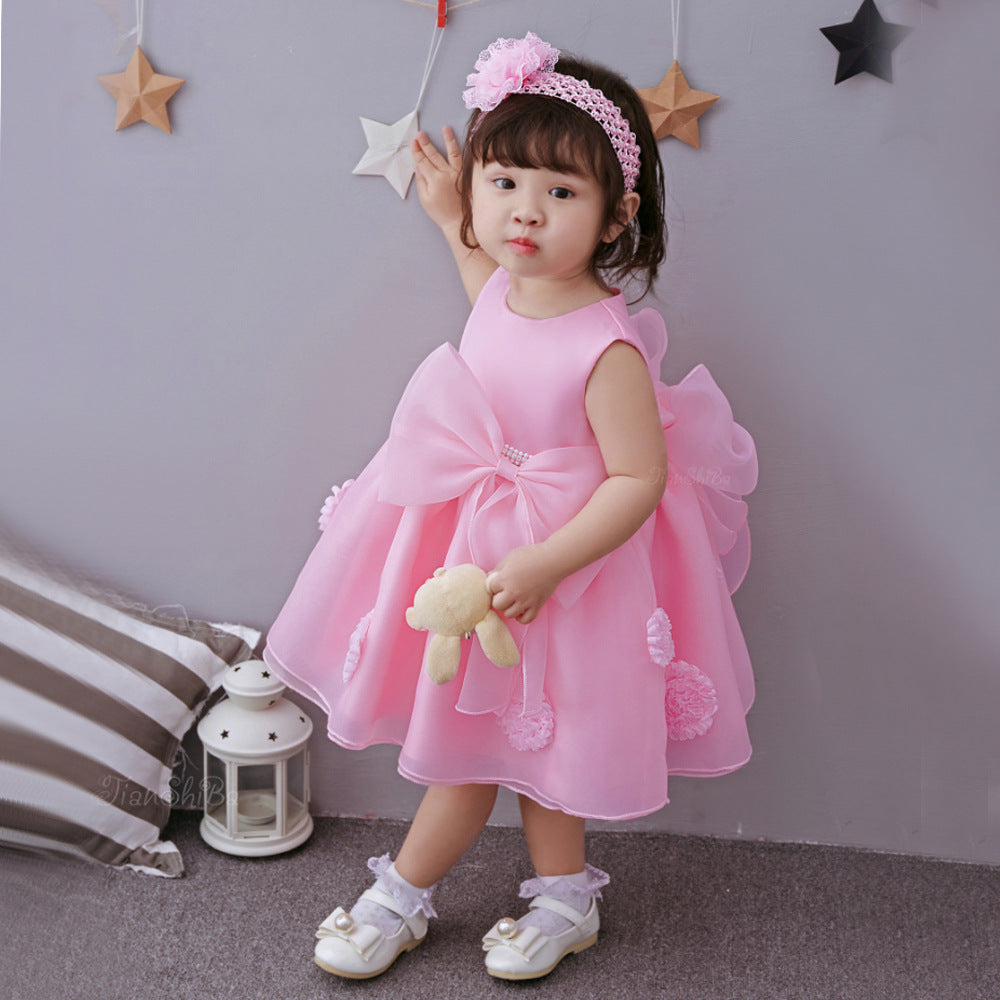 Pink summer infant baby princess dress with floral accents.
