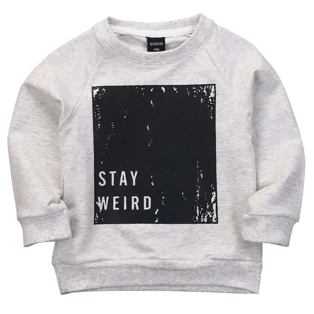 Autumn kids "Stay Weird" cotton sweater with black graphic design.