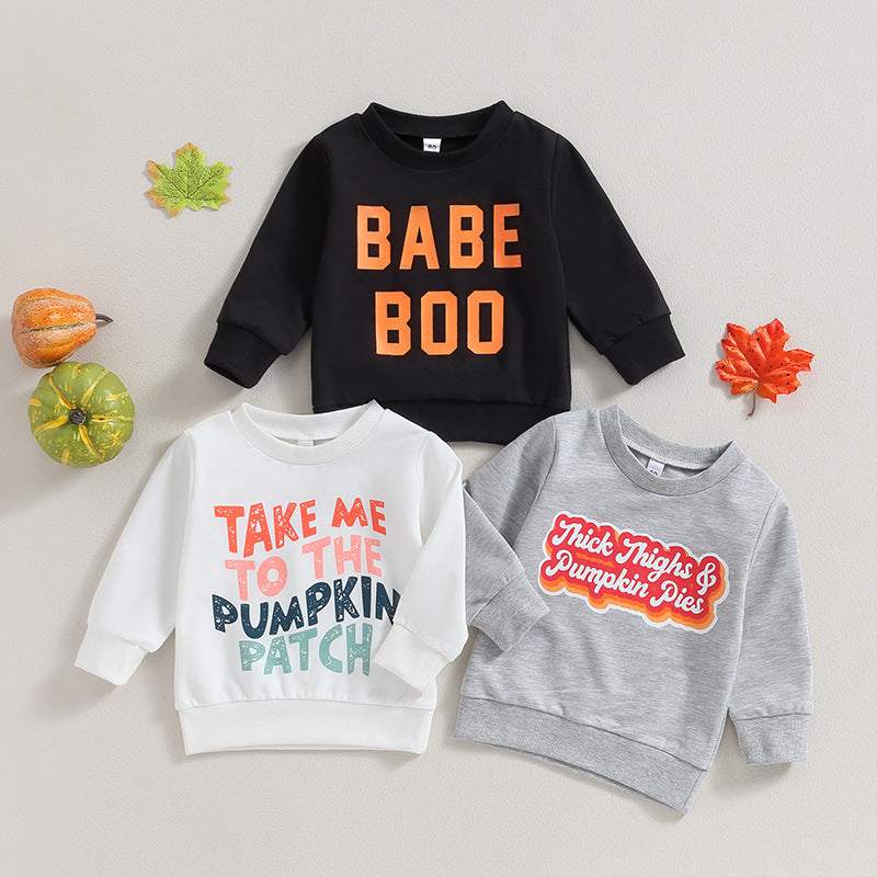 Halloween-themed long sleeve sweaters for kids with playful letters.