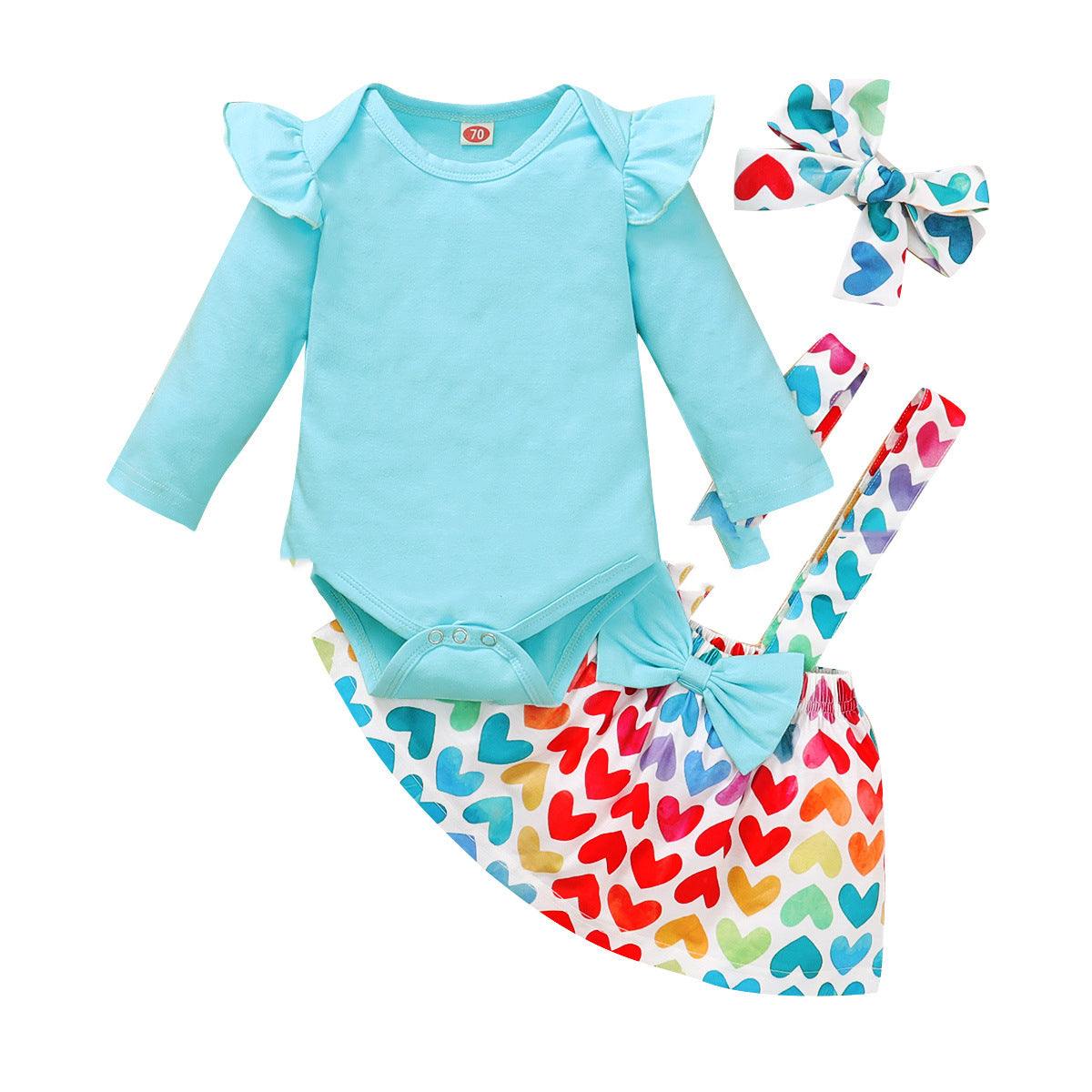 Girls' long sleeve top and heart skirt set with matching hair bows, perfect for kids aged 1-3.