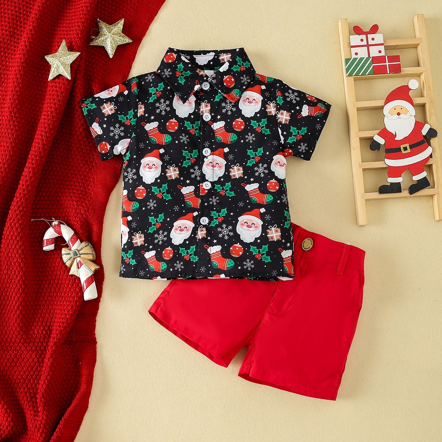 Christmas boys casual short-sleeve set; black cartoon print shirt and red shorts with holiday decoration.