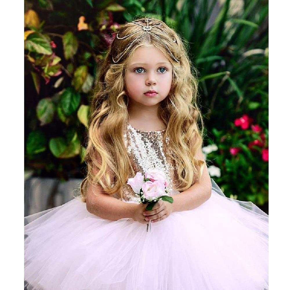 Princess flower girl in a white tutu party dress with floral accents.