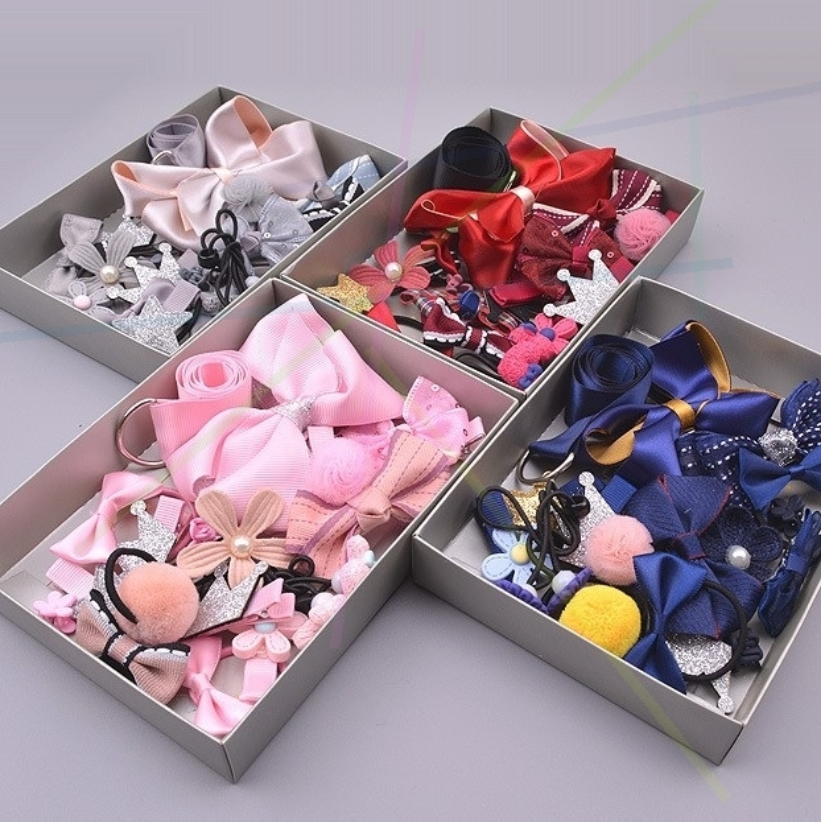 Girls 17-piece bow accessories set in various colors and designs.
