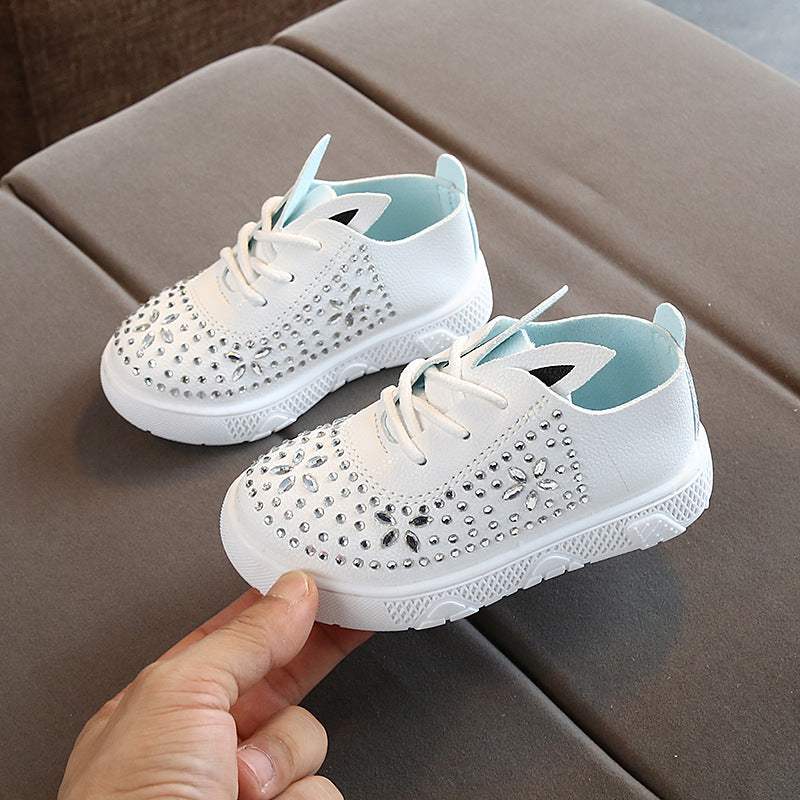 Girls leather diamond casual shoes with microfiber leather upper, rubber sole, and white color.