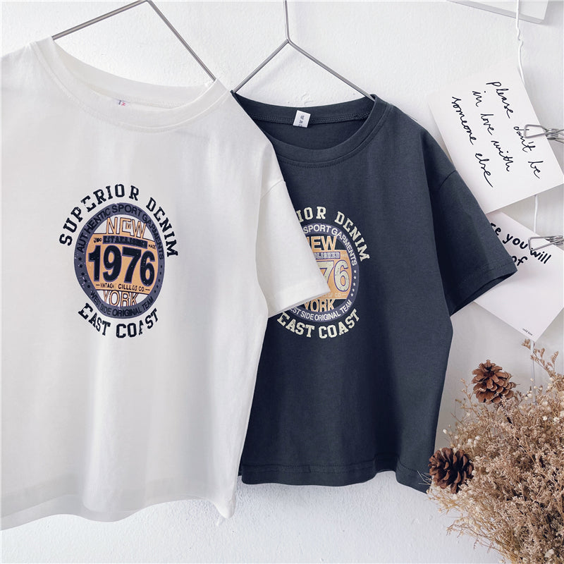 Children short sleeve western style t-shirt in white and dark gray, featuring "Superior Denim 1976" print for ages 18 months to 9 years. Made of cotton, summer wear.