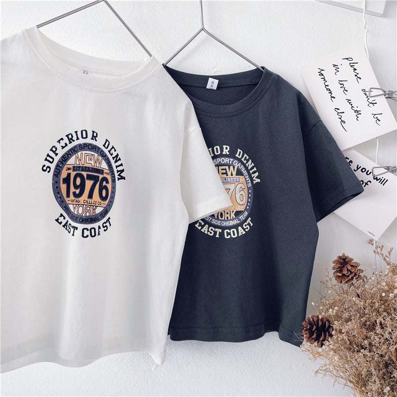 Children short sleeve western style t-shirt in white and dark gray, featuring "Superior Denim 1976" print for ages 18 months to 9 years. Made of cotton, summer wear.