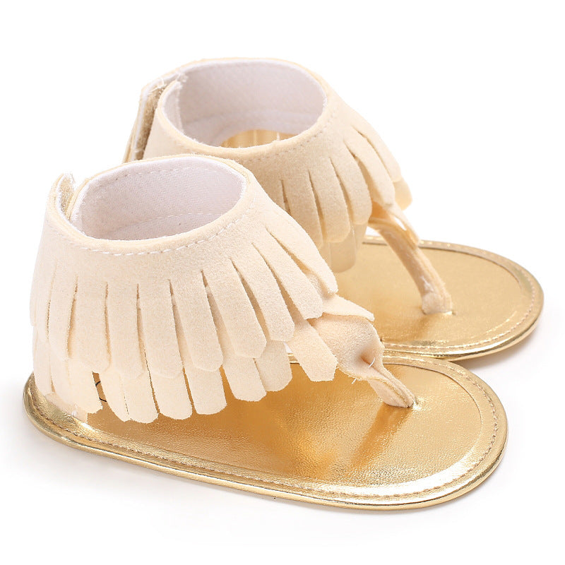 Baby girl tassel soft sole sandals with non-slip feature, beige color, perfect for summer.