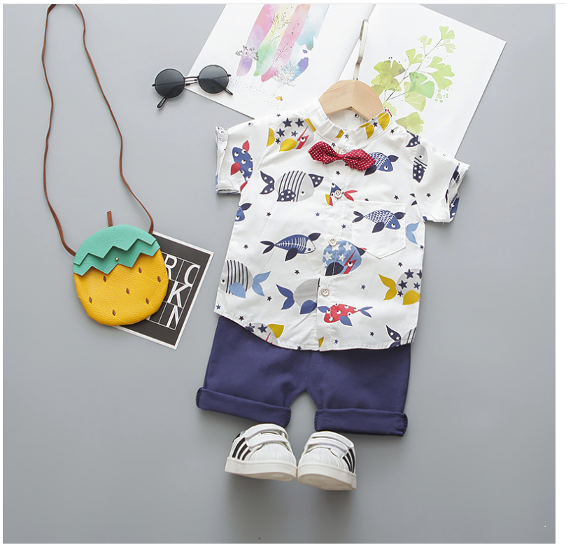 Boys fish printed bow tie set with short sleeve fish design shirt, solid shorts, and casual accessories.
