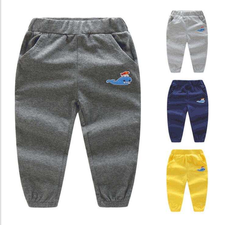 Boys Fish Thin Sweatpants in cotton, available in gray, navy, yellow, and with fish motif.