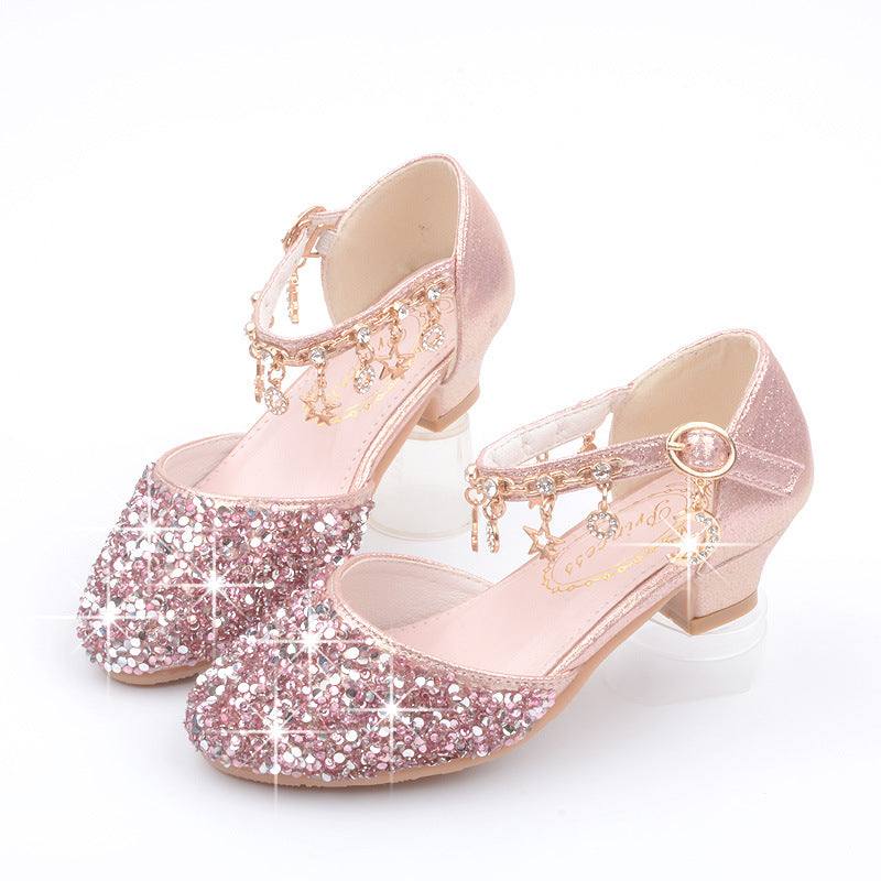 Shimmering pink dress shoes for girls with sequins and buckle strap.