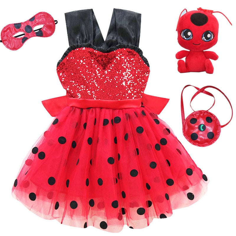 Red puffy skirt with black polka dots and accessories, featuring cotton fabric.