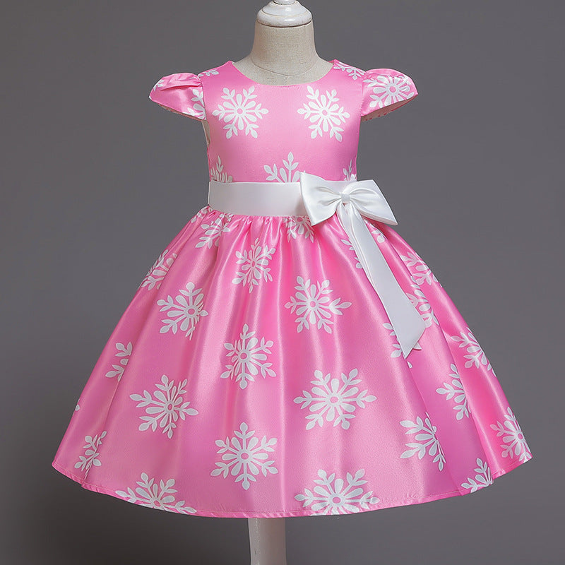 Girls formal fashion pettiskirt dress in pink with floral patterns and white bow.