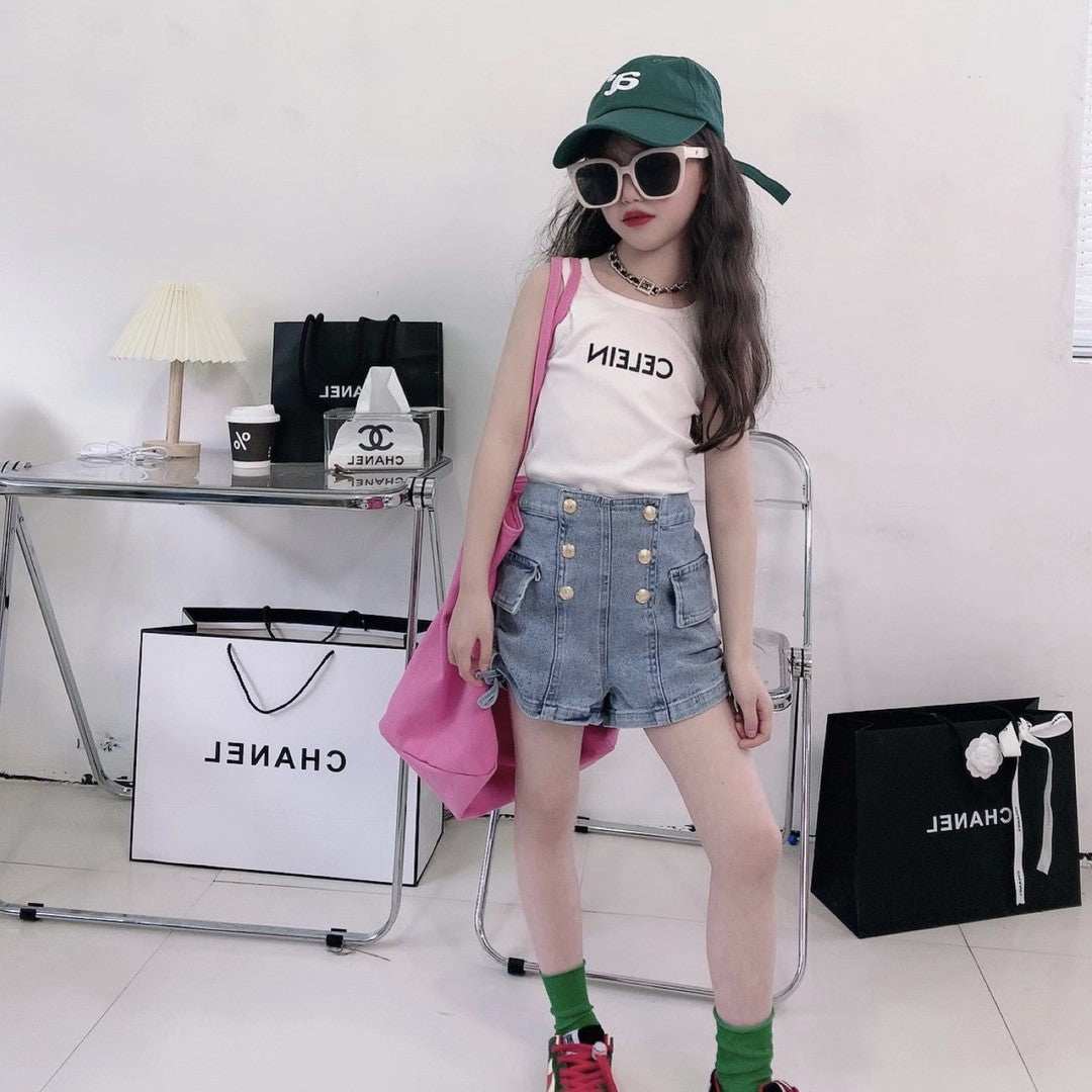 High waist summer button shorts in denim, styled with accessories in a modern indoor setup.