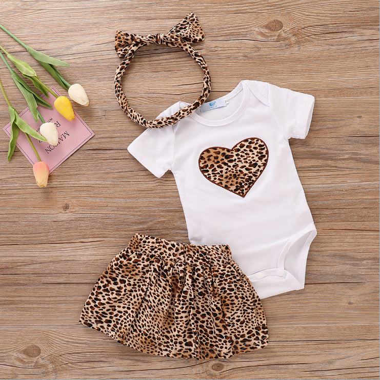 Infant printed love romper with leopard print heart and matching headband.