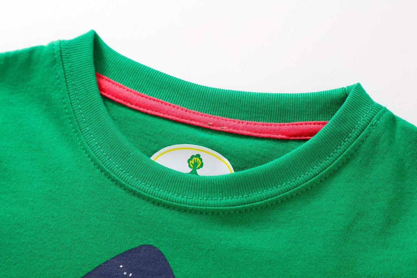 Green kids T-shirt with a colorful collar and crab print design.