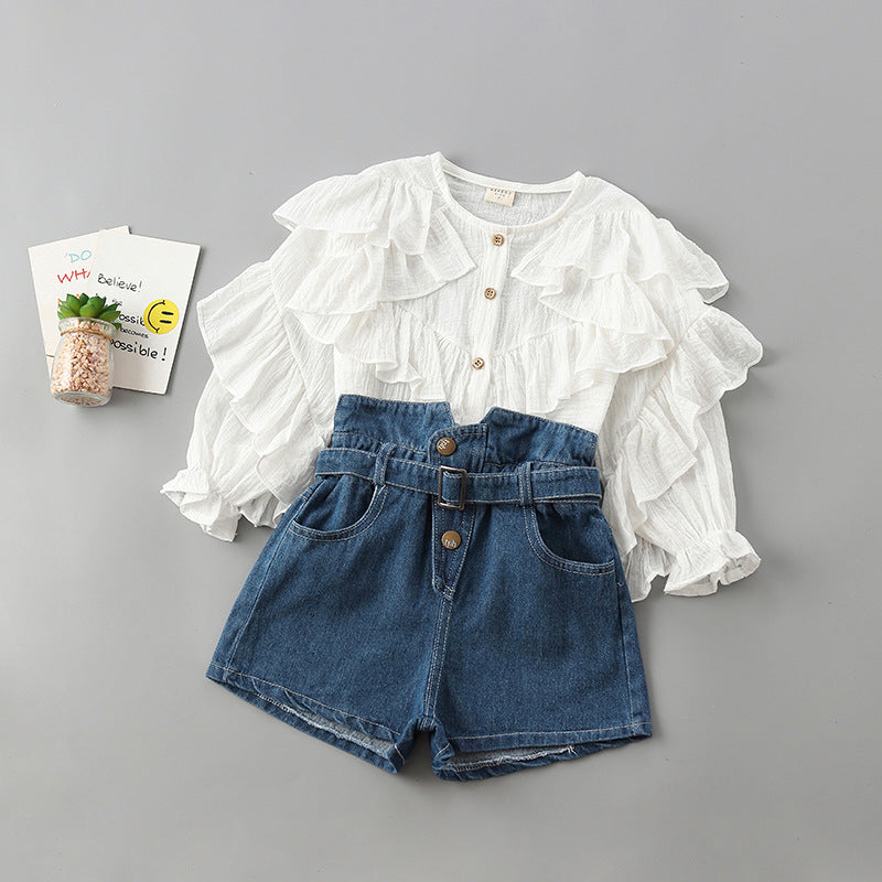 Ruffle top and denim shorts set for girls, featuring long-sleeve cotton shirt and high-waisted shorts.