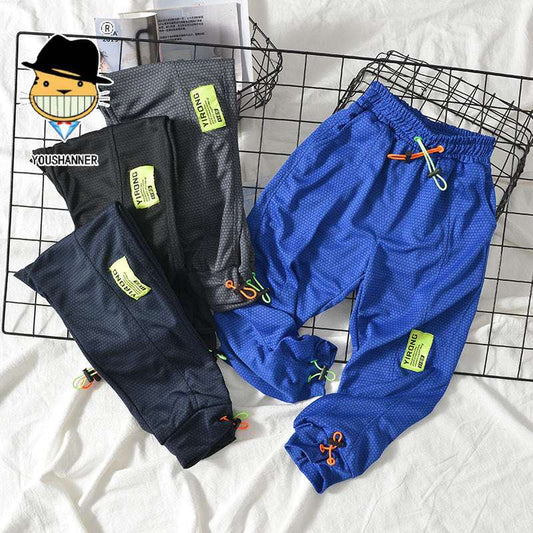 Boys Mosquito Pants in polyester, available in black, royal blue, dark gray, and navy blue.