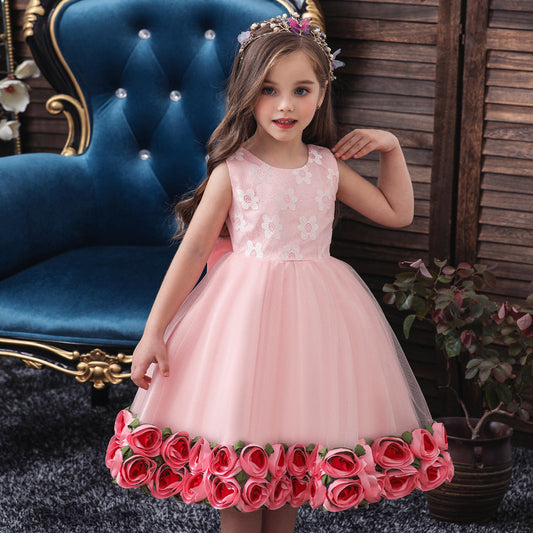 Girls rose bottom mesh dress for infants and children, featuring pleated fabric and floral accents.